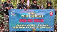 Satgas Pamtas Yonarmed 10 Kostrad Patroli Patok Perbatasan Indonesia-Malaysia